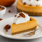 Served slice of no-bake vegan pumpkin cheesecake-card.